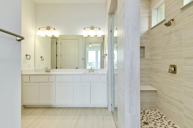 19005 Fernando Trail Austin, TX 78738 - Photo 12 of 26 Bathroom with double vanity and walk in shower