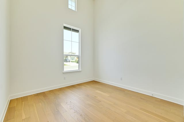 19005 Fernando Trail Austin, TX 78738 - Photo 16 of 26 Third bedroom downstairs with two story ceiling, filled with light.