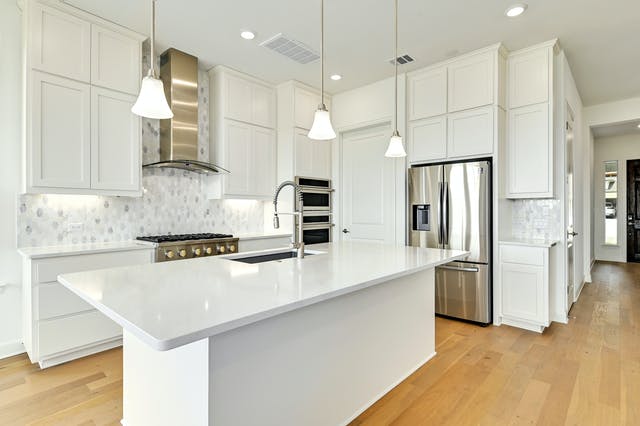 19005 Fernando Trail Austin, TX 78738 - Photo 6 of 26 Kitchen with luxury and upgraded 6 burners gas cook top, smart appliances, microwave/stove combo and extra stove.