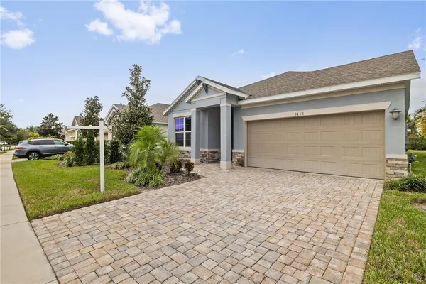 a house view with a backyard space
