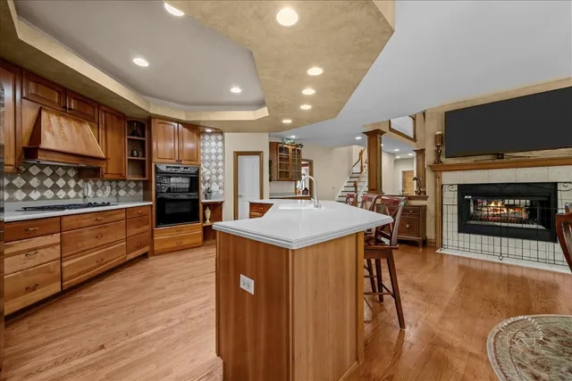 a kitchen with stainless steel appliances granite countertop a stove and a refrigerator