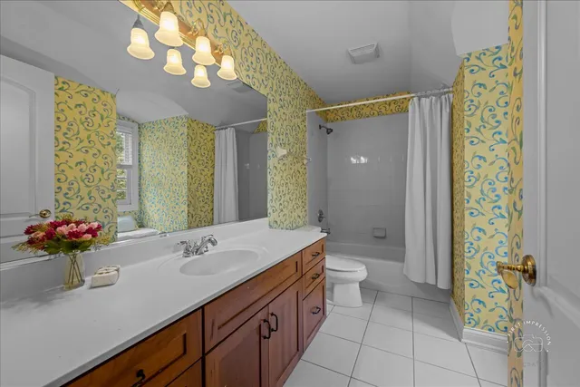 a bathroom with a sink a large mirror and a shower