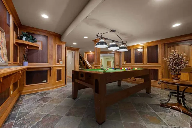 a room with lots of furniture and a clock