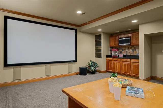 a kitchen with stainless steel appliances granite countertop a sink refrigerator and microwave