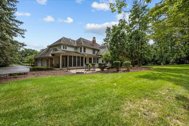 a view of a house with a backyard porch and sitting area