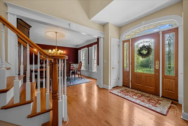 a view of an entryway with a front door and windows