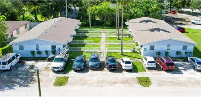 a view of backyard with swimming pool and outdoor seating