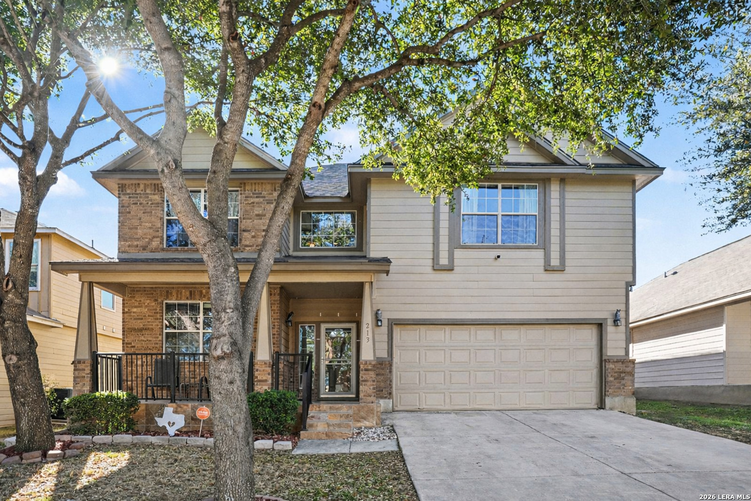 213 Wildcat Cibolo, TX 78108 - Photo 1 of 34 a front view of a house with garden