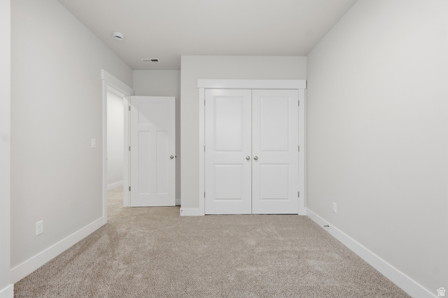 677 East 800 S Street Springville, UT 84663 - Photo 5 of 35 Unfurnished bedroom featuring light colored carpet and a closet