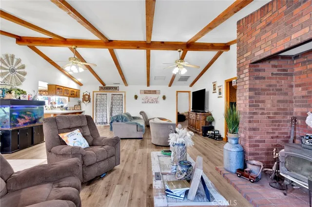 a kitchen with stainless steel appliances kitchen island granite countertop a stove and a refrigerator