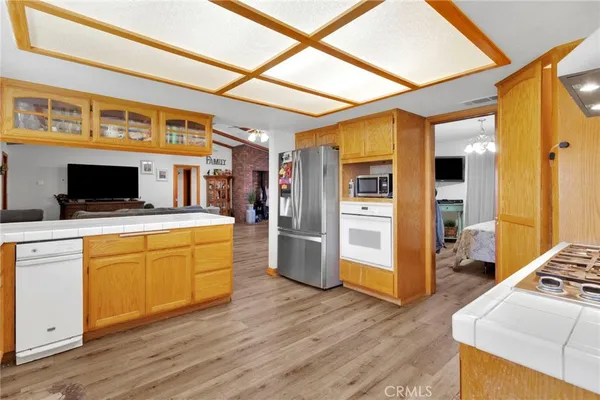a kitchen with stainless steel appliances a stove a refrigerator and cabinets