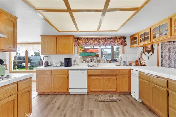 a view of washer and dryer with kitchen view