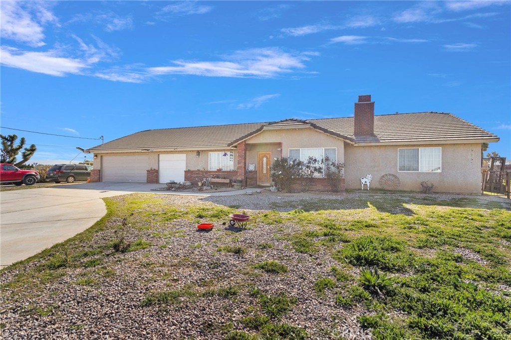 10276 Aster Road Oak Hills, CA 92344 - Photo 2 of 65 Front of the home.