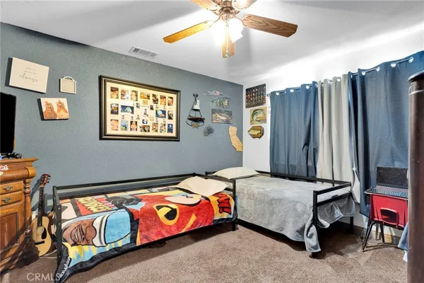 a bed room with a bed and a flat screen tv