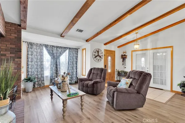a living room with furniture or fireplace and a flat screen tv