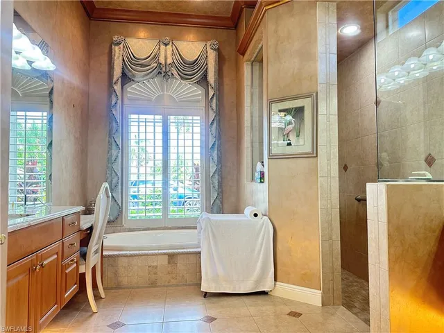 a bathroom with a tub and a sink