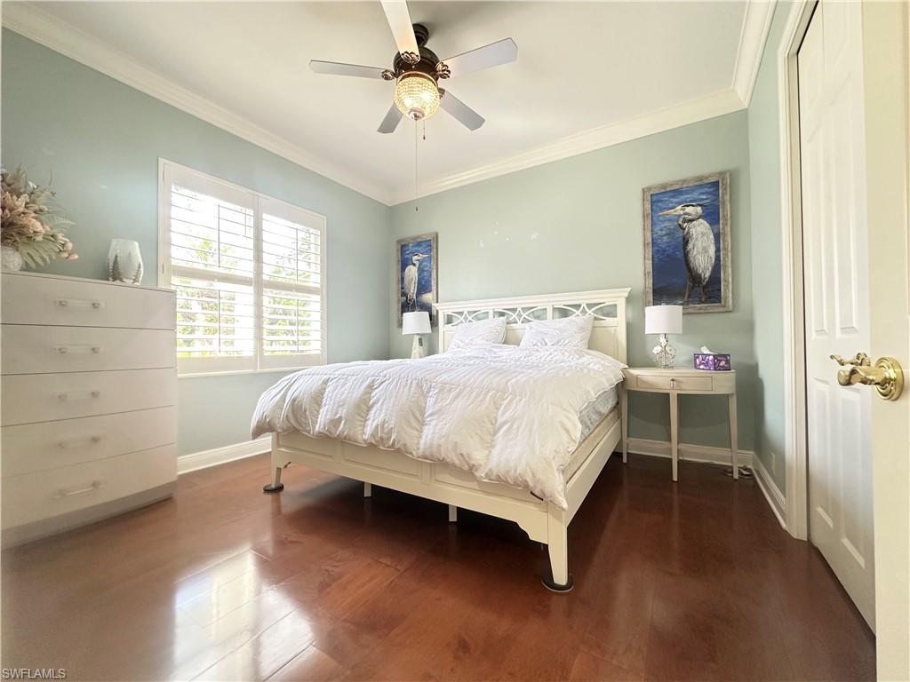 8411 Mallow Lane Naples, FL 34113 - Photo 20 of 31 a bedroom with a bed and a window