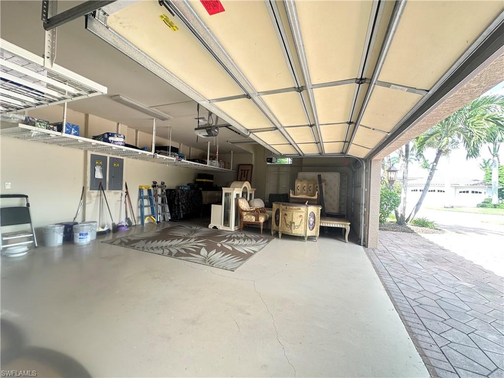 8411 Mallow Lane Naples, FL 34113 - Photo 23 of 31 a view of a patio with table and chairs