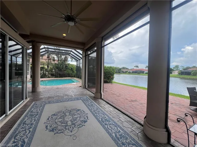 a view of a porch with wooden floor and a table
