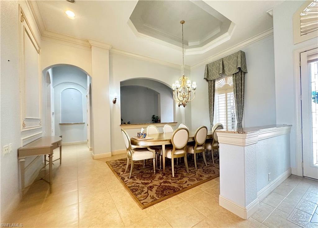 8411 Mallow Lane Naples, FL 34113 - Photo 4 of 31 a view of a dining room with furniture