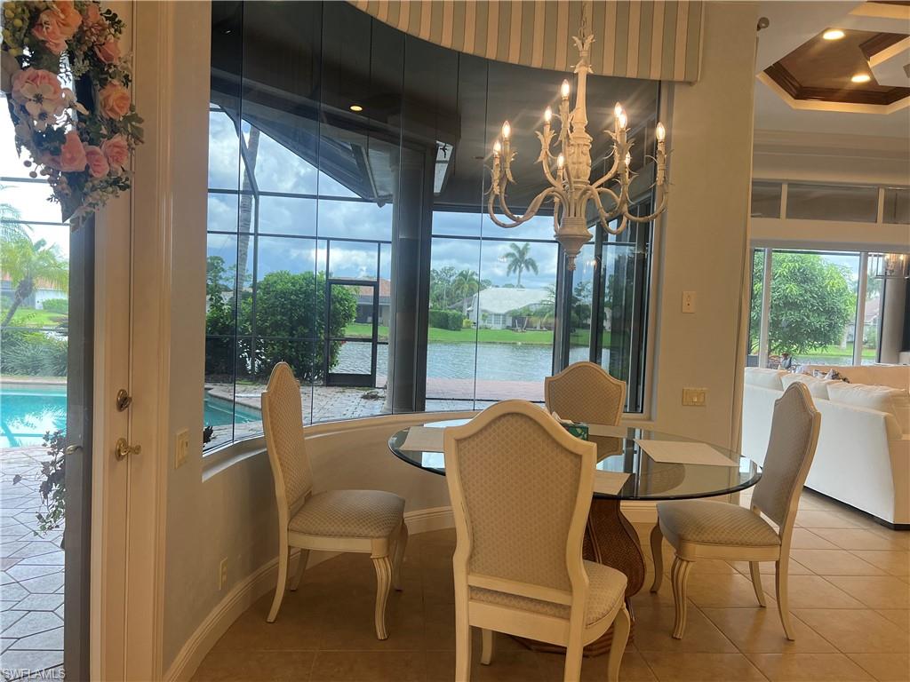 8411 Mallow Lane Naples, FL 34113 - Photo 7 of 31 a dining room with furniture and window