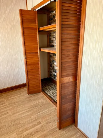a view of front door and wooden floor