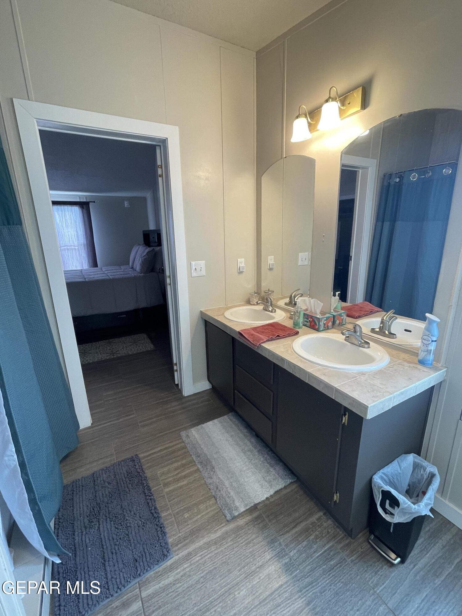 2901 Cook Street Truth Or Consequences, NM 87901 - Photo 13 of 28 a bathroom with a sink and a mirror