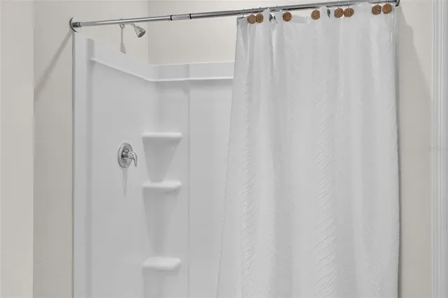 a bathroom with a shower curtain