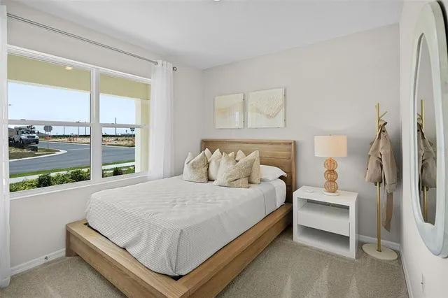 a bedroom with a bed and window