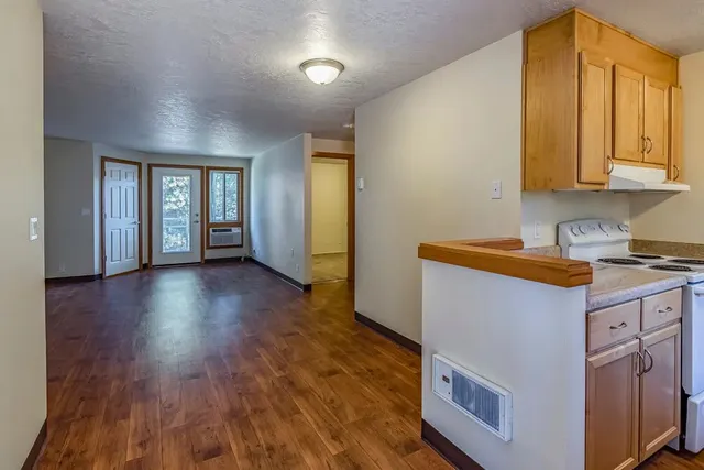 a kitchen with a sink and a stove top oven