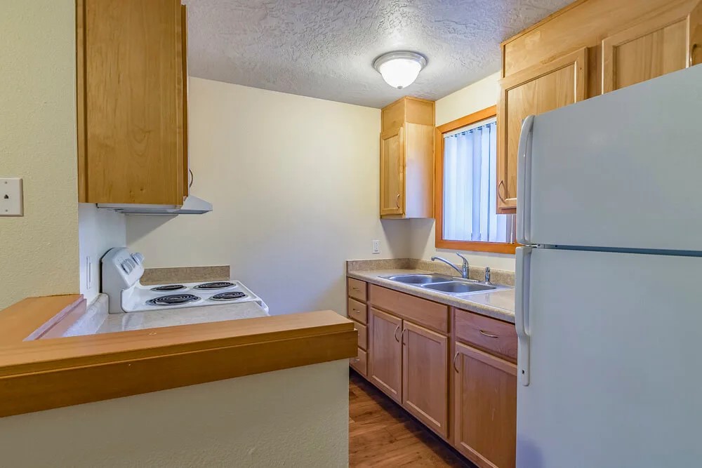 39501 Evans Street Sandy, OR 97055 - Photo 12 of 15 a kitchen with a sink and a stove top oven