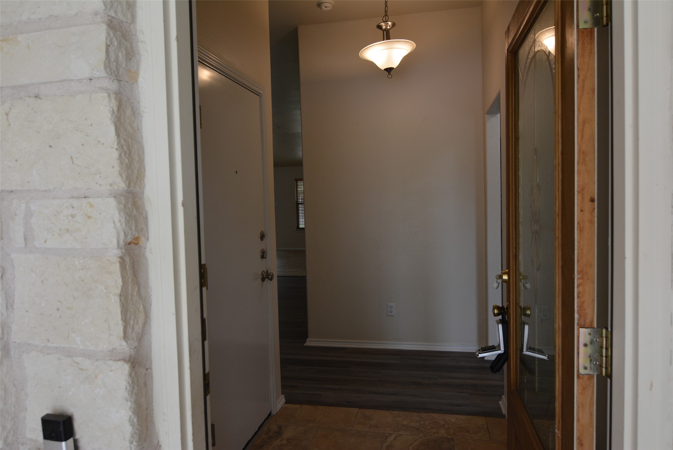 1303 Horseshoe Ranch Drive Leander, TX 78641 - Photo 5 of 26 Step into a welcoming entry with mixed flooring and an overhead light fixture.