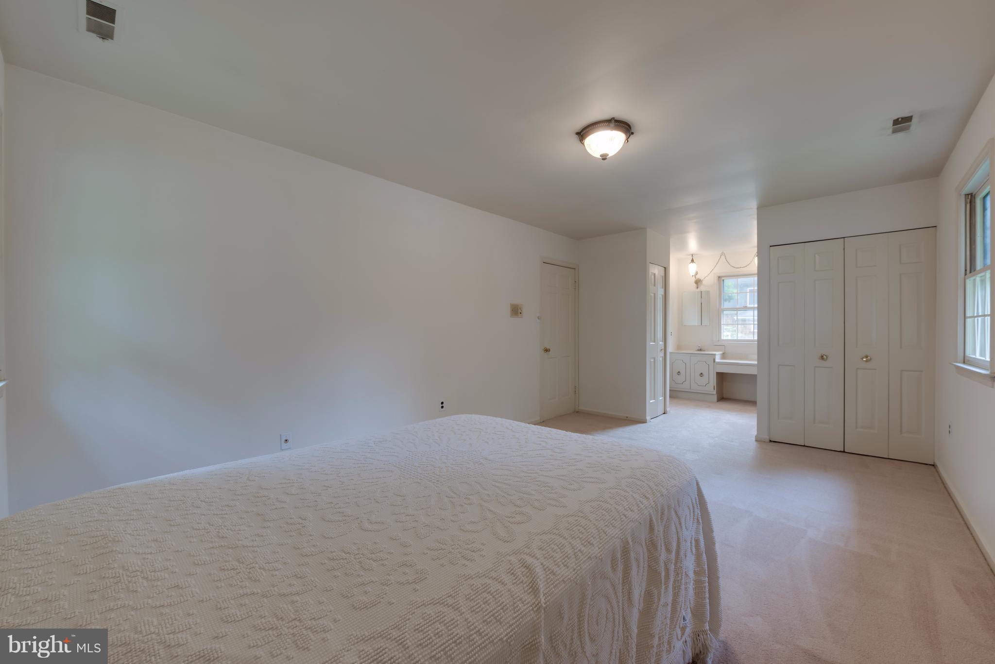 314 Ayito Road Southeast Vienna, VA 22180 - Photo 6 of 12 a view of a big room with closet and chandelier fan