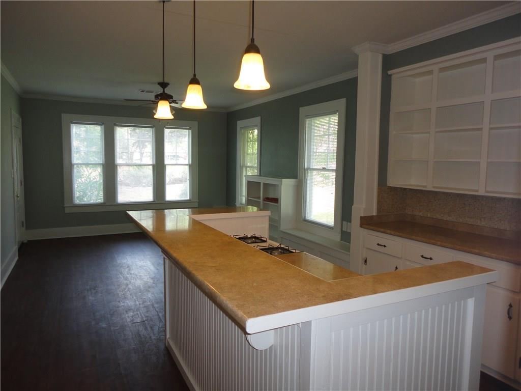 200 East 33rd Street Austin, TX 78705 - Photo 11 of 27 a view of a kitchen with a sink and large windows