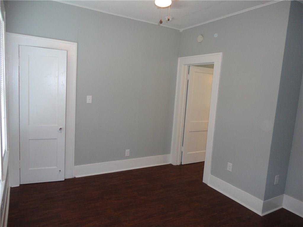 200 East 33rd Street Austin, TX 78705 - Photo 13 of 27 an empty room with wooden floor and closet