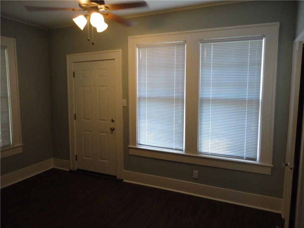 200 East 33rd Street Austin, TX 78705 - Photo 14 of 27 an empty room with wooden floor and windows