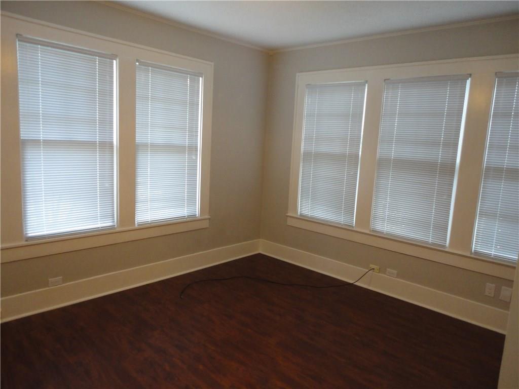 200 East 33rd Street Austin, TX 78705 - Photo 16 of 27 a view of an empty room with wooden floor and a window