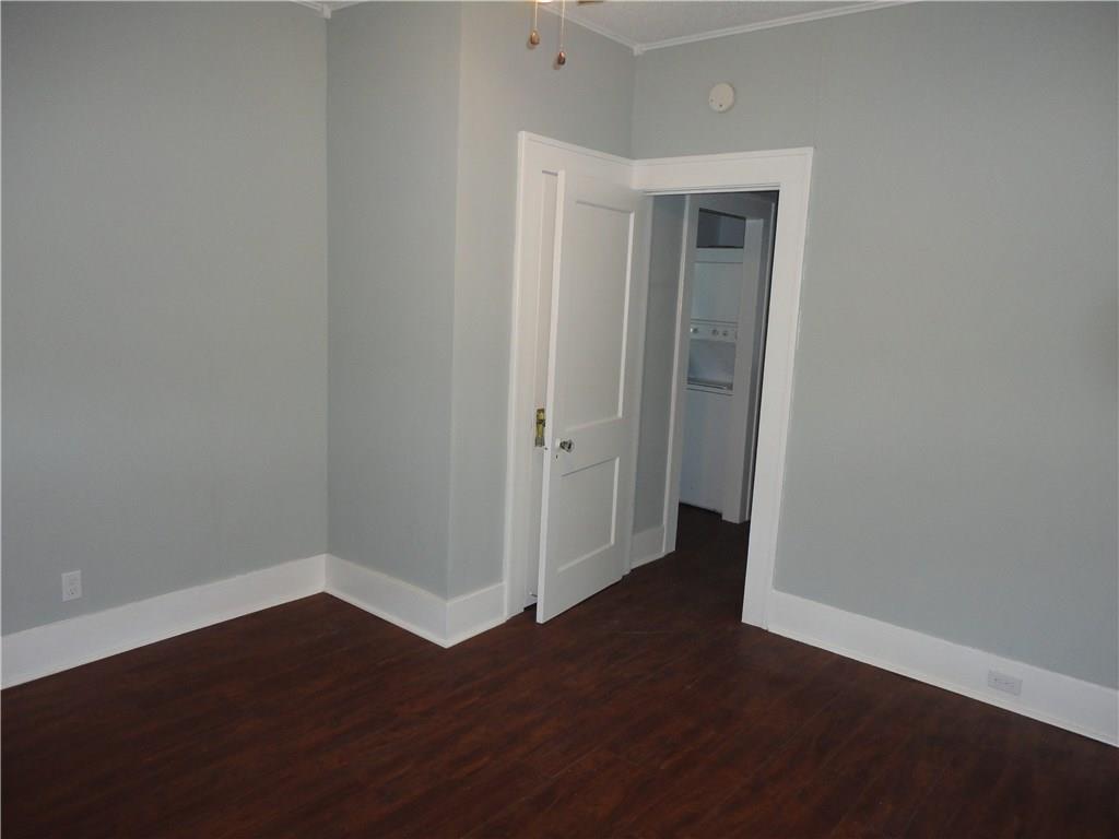 200 East 33rd Street Austin, TX 78705 - Photo 22 of 27 an empty room with wooden floor