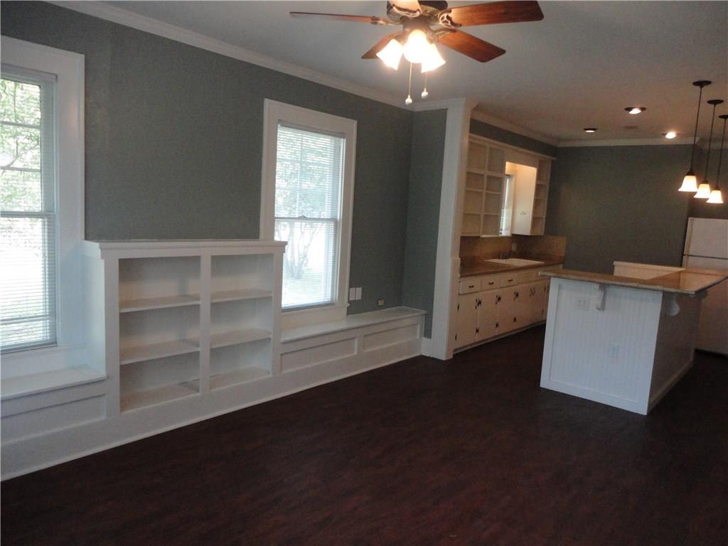 200 East 33rd Street Austin, TX 78705 - Photo 5 of 27 a view of an empty room with a window and wooden floor