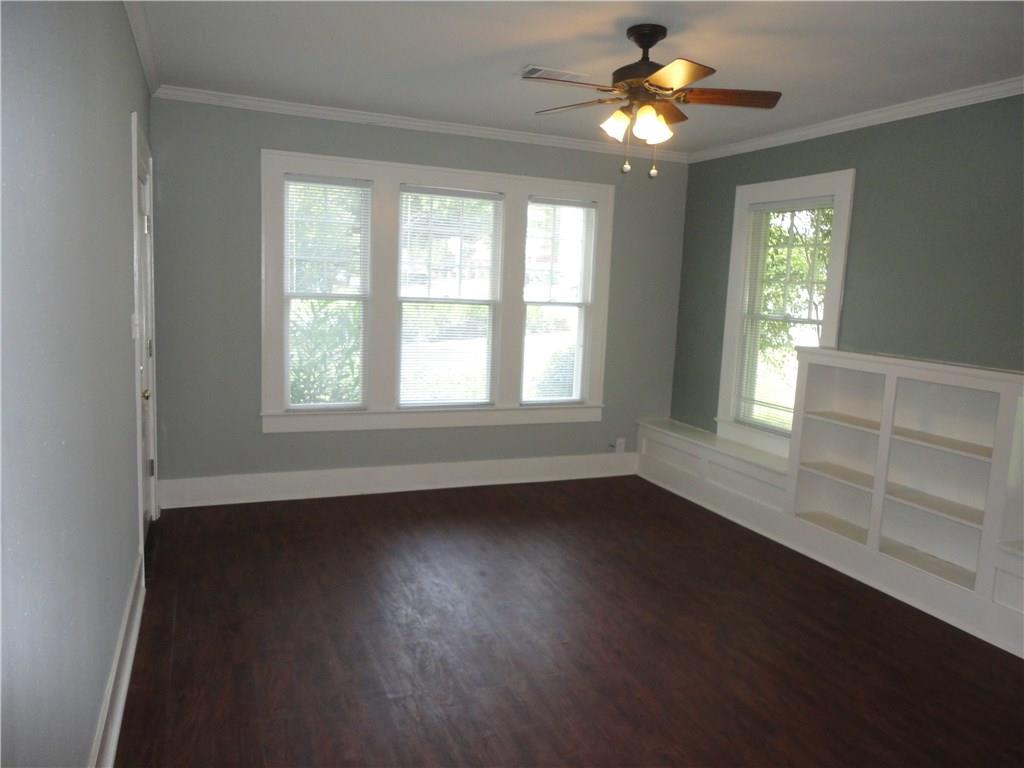 200 East 33rd Street Austin, TX 78705 - Photo 7 of 27 a view of an empty room with a window and wooden floor