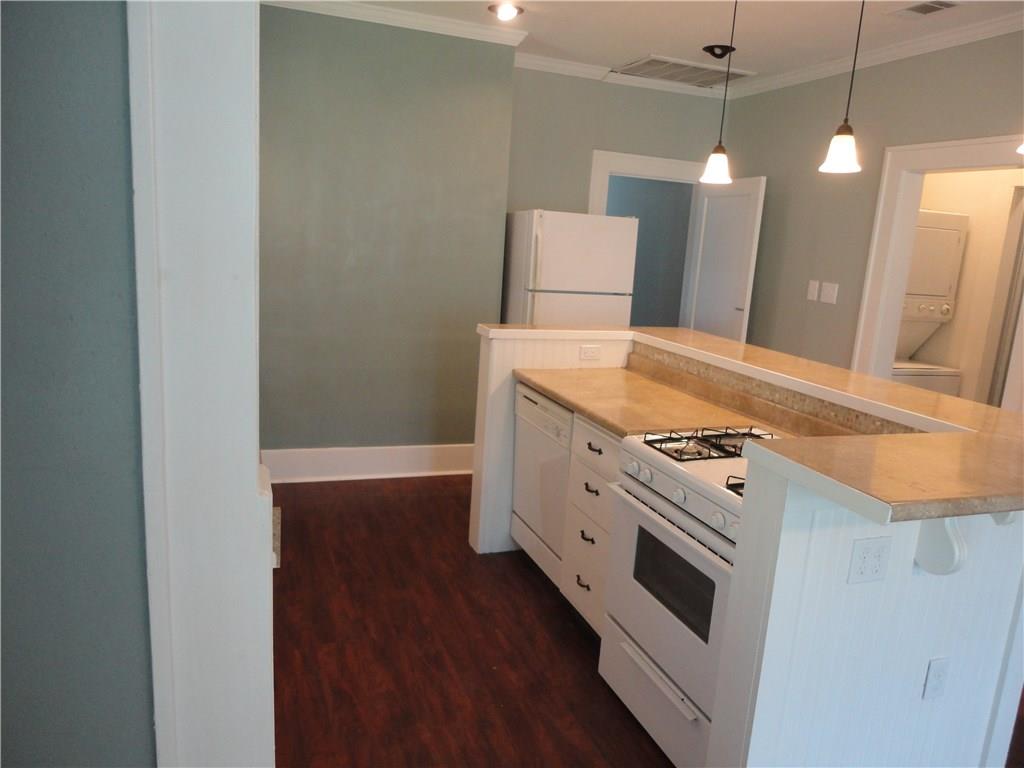 200 East 33rd Street Austin, TX 78705 - Photo 10 of 27 a kitchen with granite countertop a stove and a sink