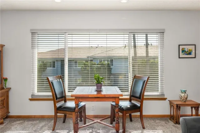 a dining room with furniture and windows