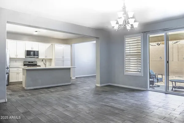a kitchen with a stove a sink and a refrigerator