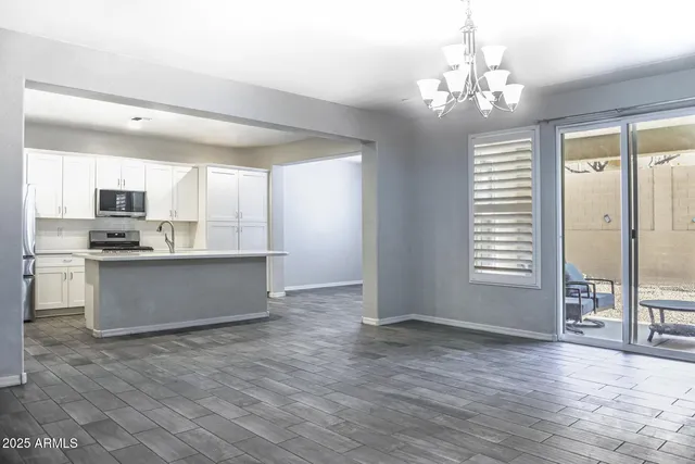 a kitchen with a stove a sink and a refrigerator