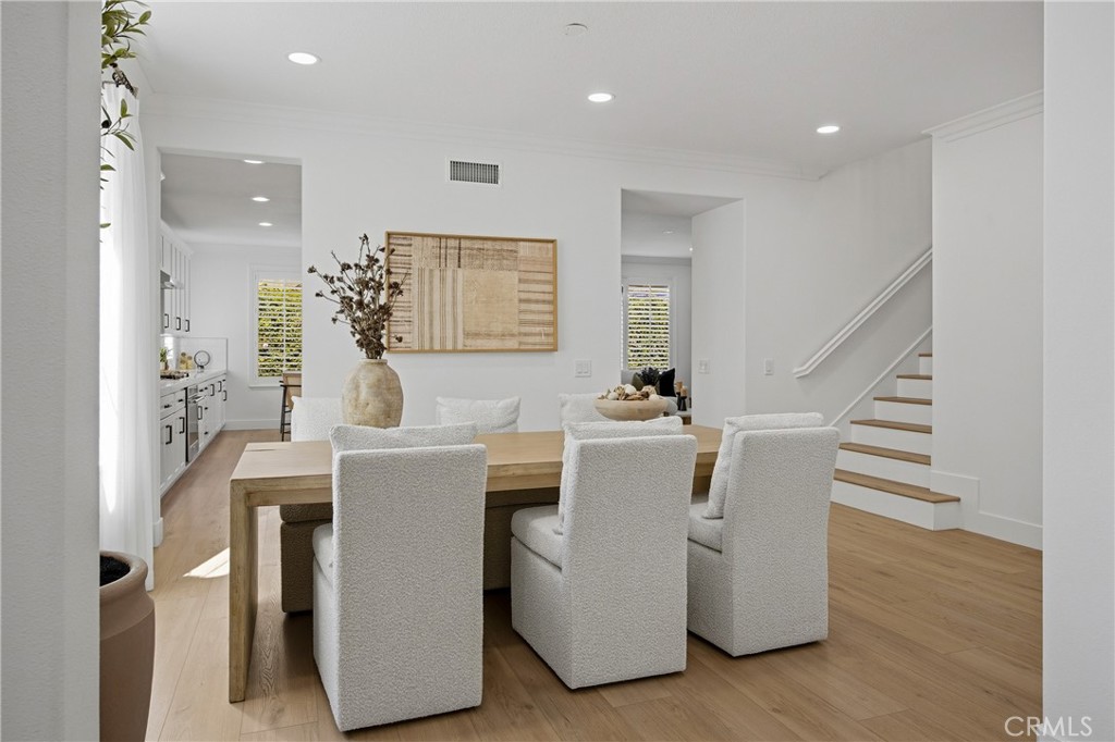 3 Tudor Way Ladera Ranch, CA 92694 - Photo 11 of 25 a dining room with furniture and wooden floor