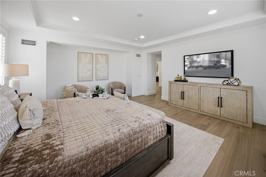 3 Tudor Way Ladera Ranch, CA 92694 - Photo 12 of 25 a bedroom with a bed and flat screen tv