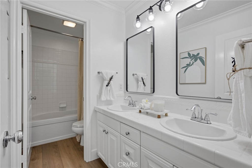 3 Tudor Way Ladera Ranch, CA 92694 - Photo 17 of 25 a bathroom with a double vanity sink and a mirror