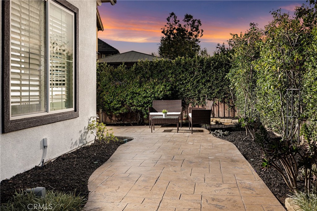3 Tudor Way Ladera Ranch, CA 92694 - Photo 23 of 25 a view of a backyard with sitting area