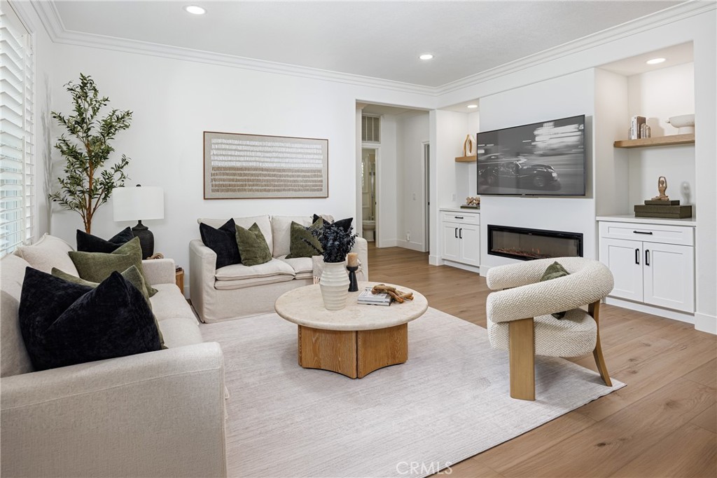 3 Tudor Way Ladera Ranch, CA 92694 - Photo 7 of 25 a living room with furniture and a large mirror