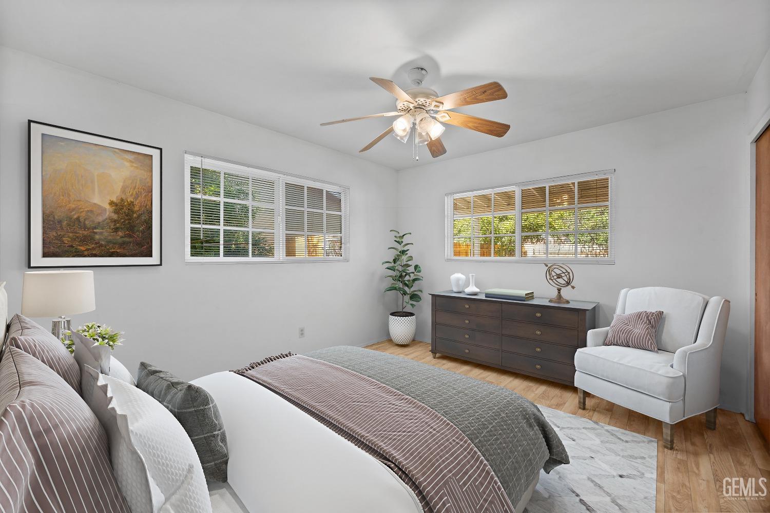 Undisclosed Address Bakersfield, CA 93309 - Photo 13 of 32 a bedroom with a bed couch and window